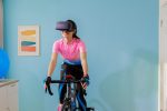 woman cycling with VR glasses